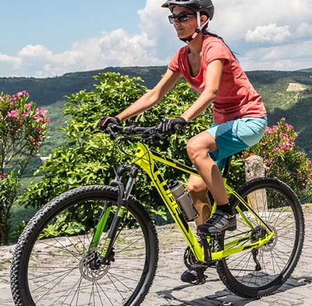 female mountain biker on a Cube hardtail MTB